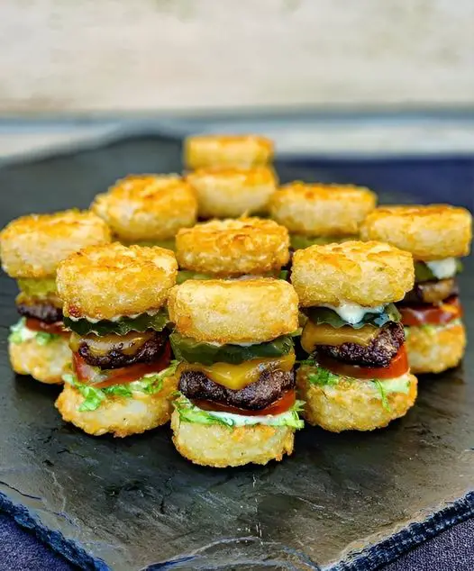 Little tatter tot cheese burgers with pickles.